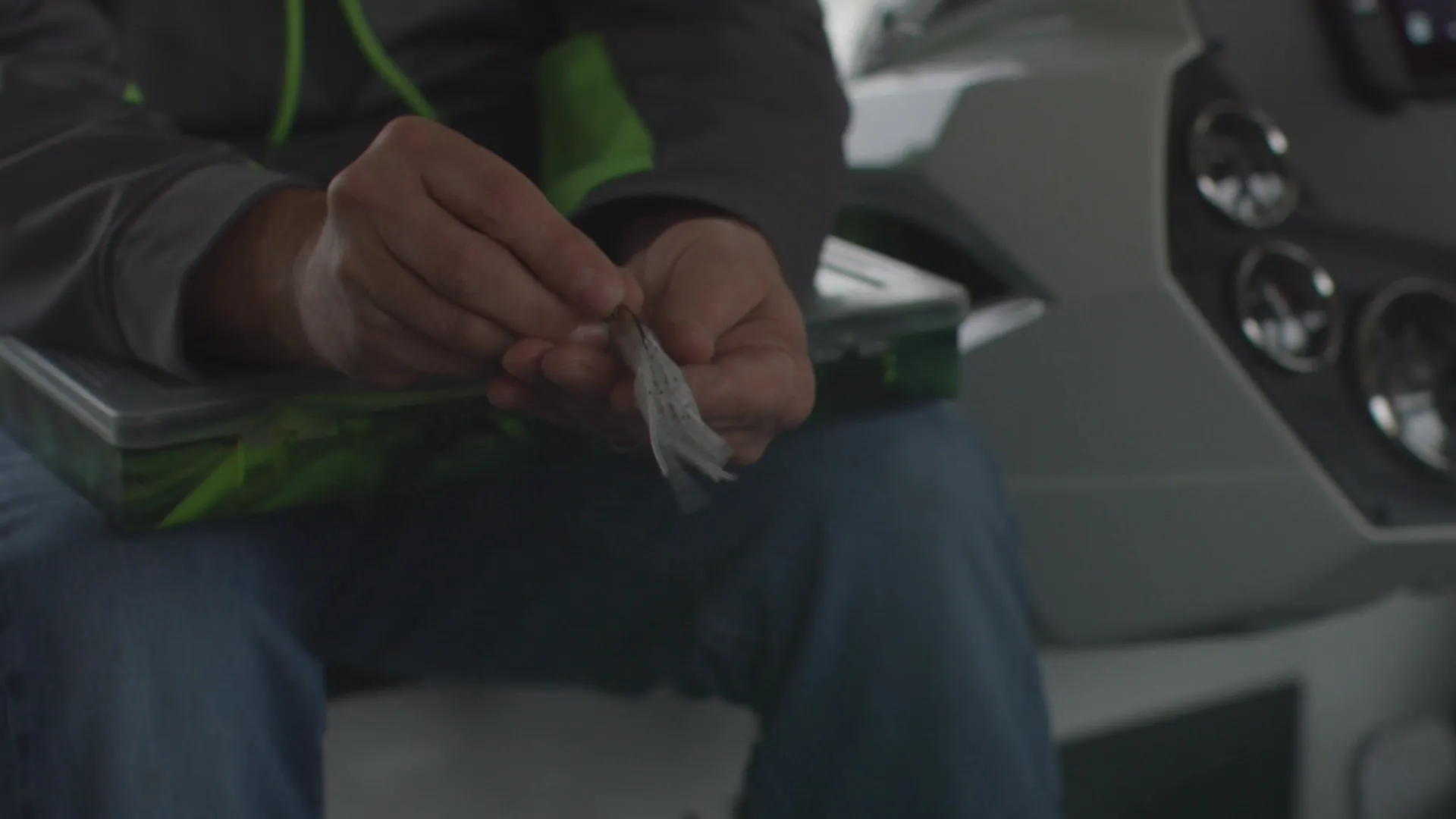 Secret Lures angler rigging a handmade lure in his boat